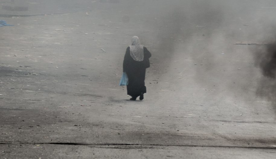 אישה פלסטינית בחברון בעת מהומות